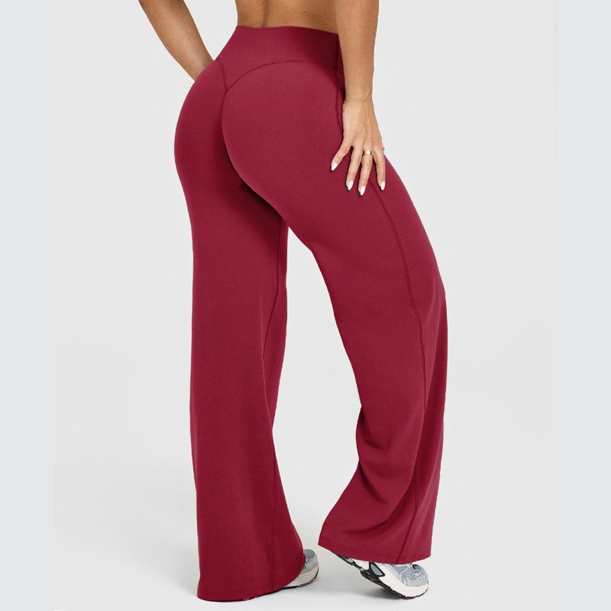 Women's straight-leg yoga pants in wine red, high-waist design with smooth seams.