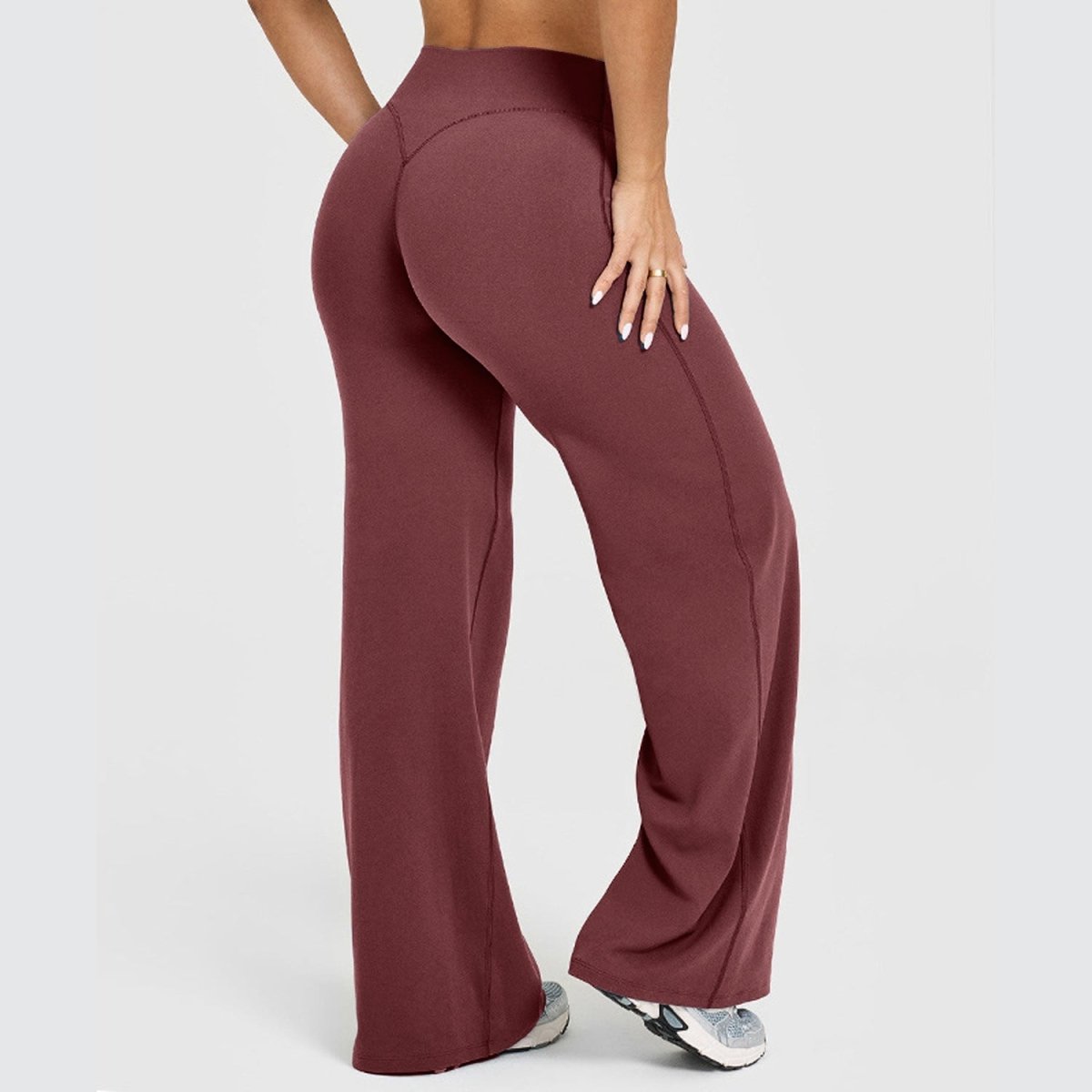 Women's straight-leg yoga pants by Ancient Energy in burgundy stretch fabric.