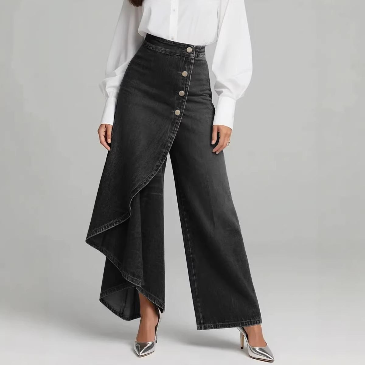 Women's black denim straight-leg pants with an asymmetric wrap front and large metal button row