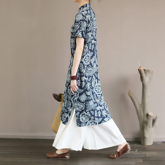 Mandotos International retro floral cotton dress with side slit, featuring vibrant flower patterns and a stylish, flowy design.