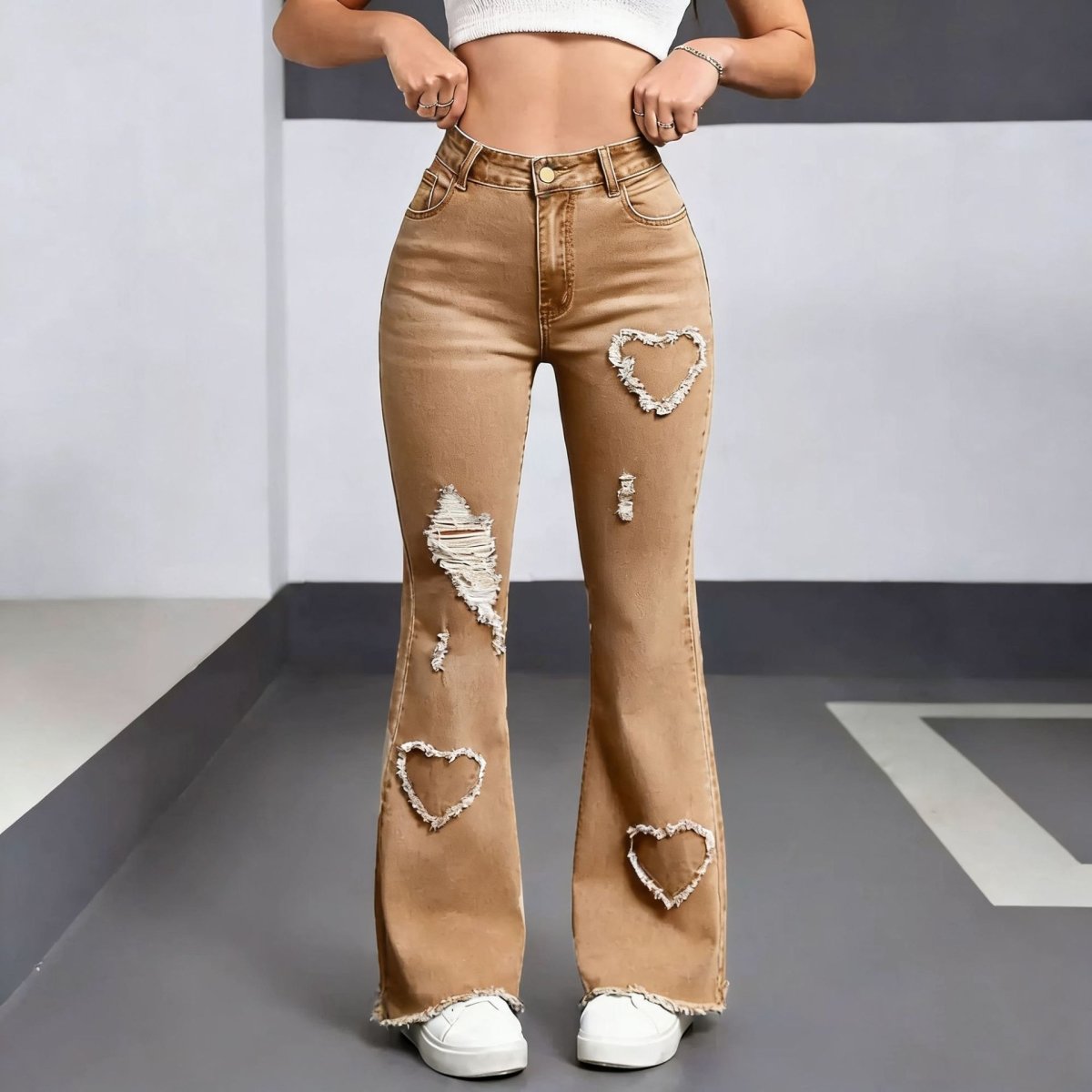 Stylish Casual Denim Jeans For Women in tan denim with distressed patches and heart-shaped tears