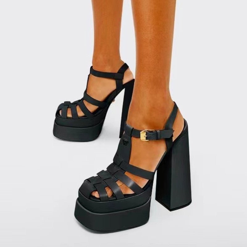 Platform sandals by Ancient Energy; black with chunky block heels, multiple straps and ankle buckle.
