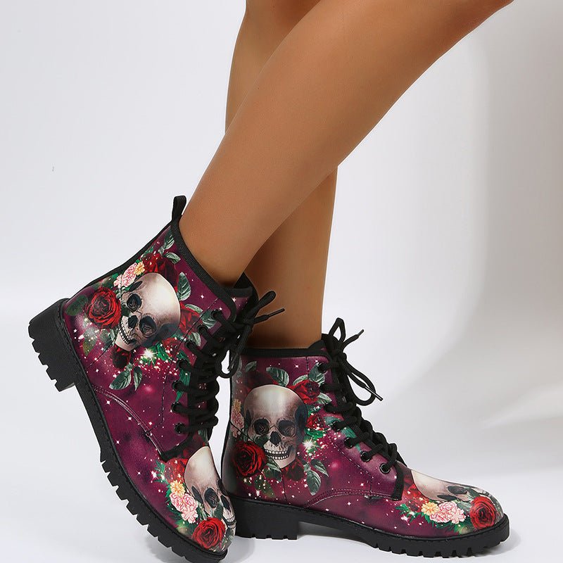 Workwear Boots; women's high-top combat boots (pair) with skull and rose Halloween print on maroon background.