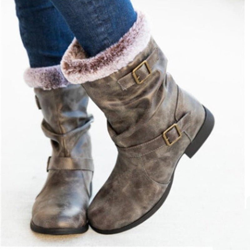 Warm women's snow boots by Ancient Energy in brown suede with faux fur trim and buckle straps.