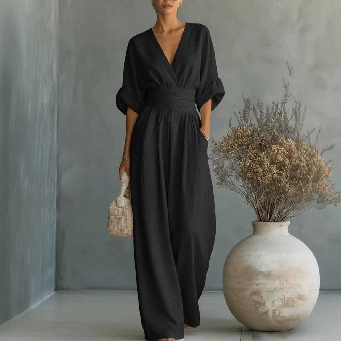 Summer short-sleeved jumpsuit in black with V-neck and wide-leg pants by Ancient Energy