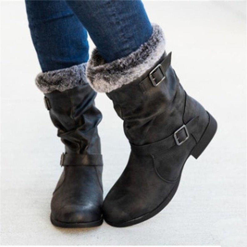 Women's warm snow boots, black with faux-fur trim and buckled straps, mid-calf pair.