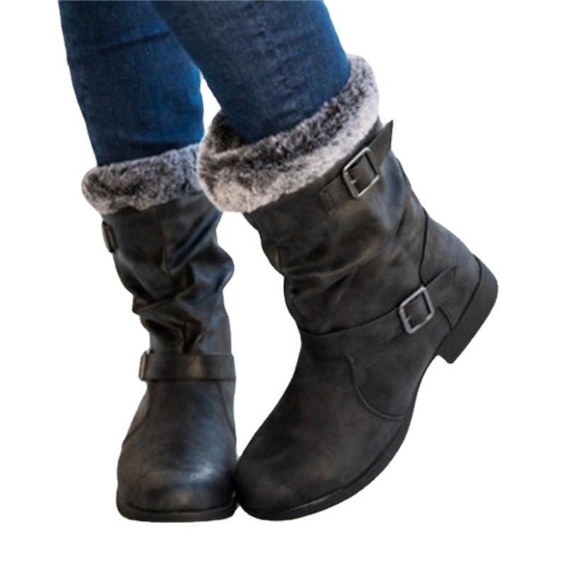 Warm women's snow boots in black faux leather with fur-trimmed cuffs and buckles