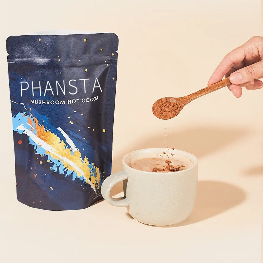 Ground cocoa coffee by Ancient Energy, showing a close-up of the dark, rich powdered mixture in a bowl.