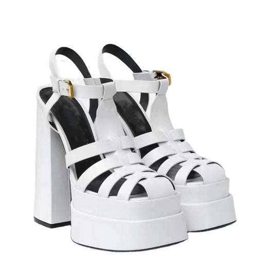 White strappy platform sandals with thick block heels and ankle buckles by Ancient Energy