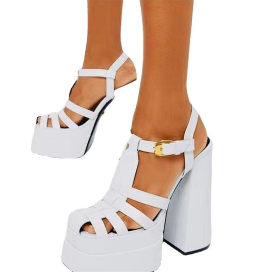 White platform sandals with a thick block heel, strappy upper and ankle buckle