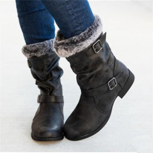 Women's warm snow boots, black with faux-fur trim and buckled straps, mid-calf pair.