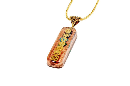 7 chakra orgone copper pendant with chain from Ancient Energy, featuring colorful chakra stones and intricate metalwork.