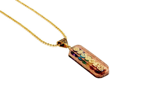 7 chakra Orgone Copper Pendant with chain from Ancient Energy, featuring colorful chakra stones and intricate copper design.