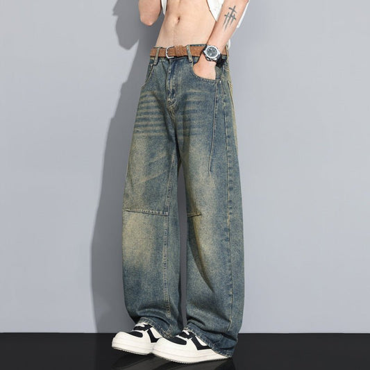 Men's straight-leg denim jeans in washed blue with faded panels.