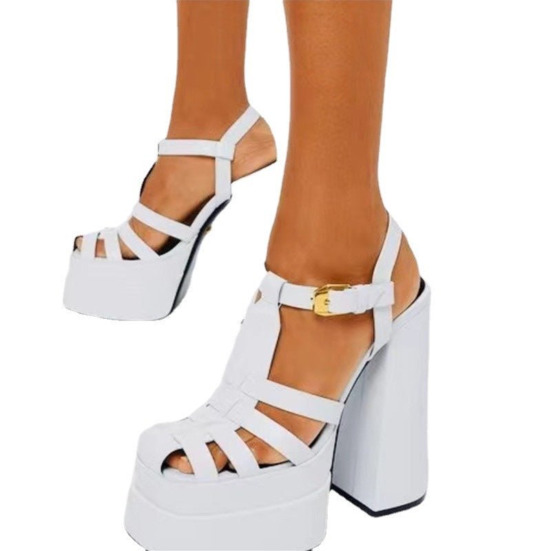 White platform sandals with a thick block heel, strappy upper and ankle buckle