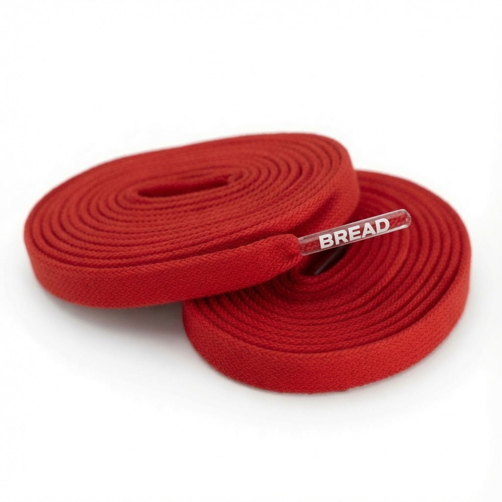 Bright red elastic shoelace by Bread, featuring a flexible, stretchable design perfect for athletic and casual shoes.