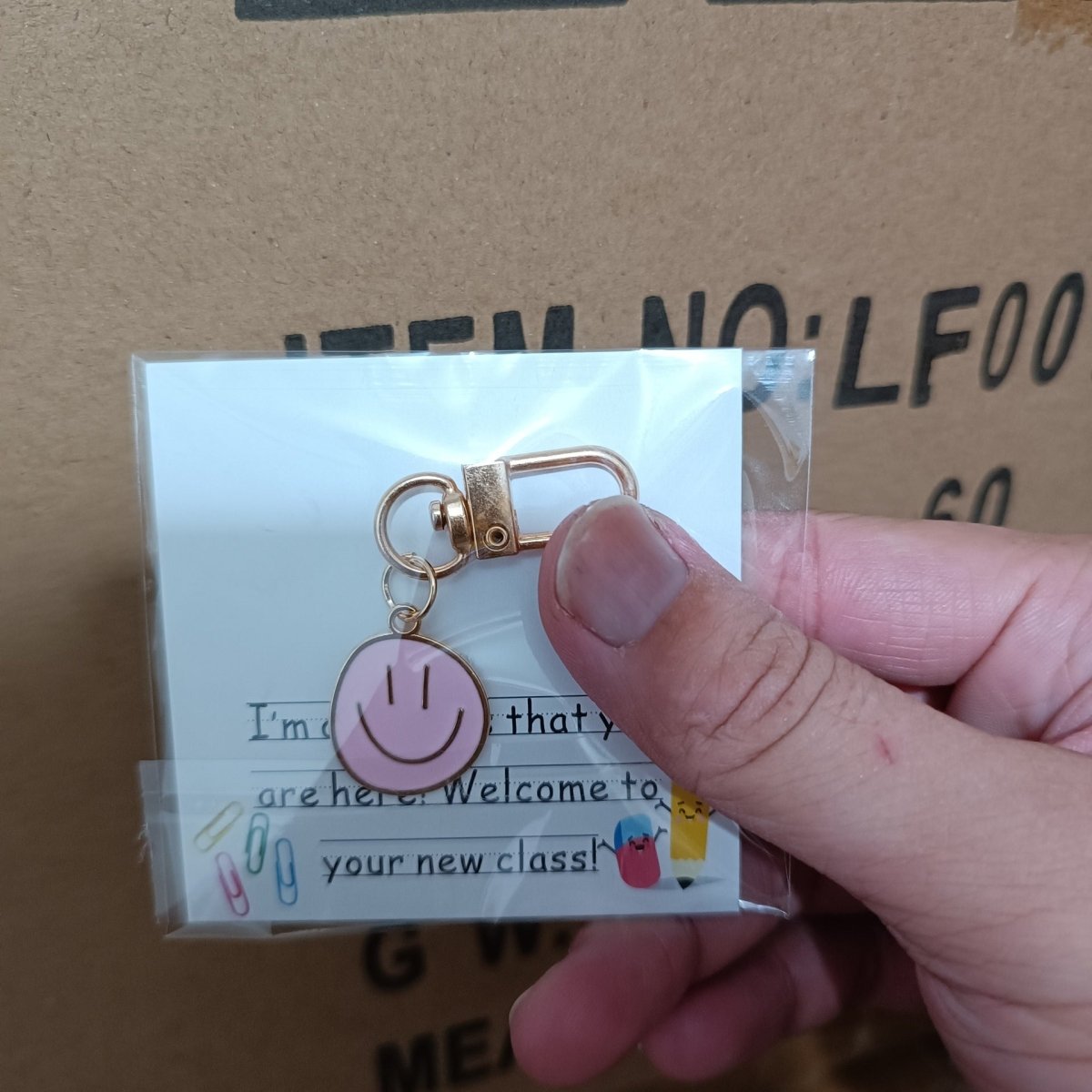 Cross-border e-commerce alloy color dripping smiley face keychain electroplated gold irregular expression bag pendant accessories - MANDOTOS INTERNATIONAL