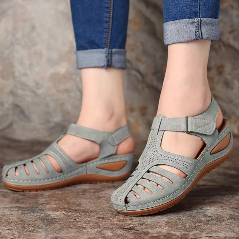 Women's plus-size retro round-toe wedge sandals in grey with cutout design and brown sole.