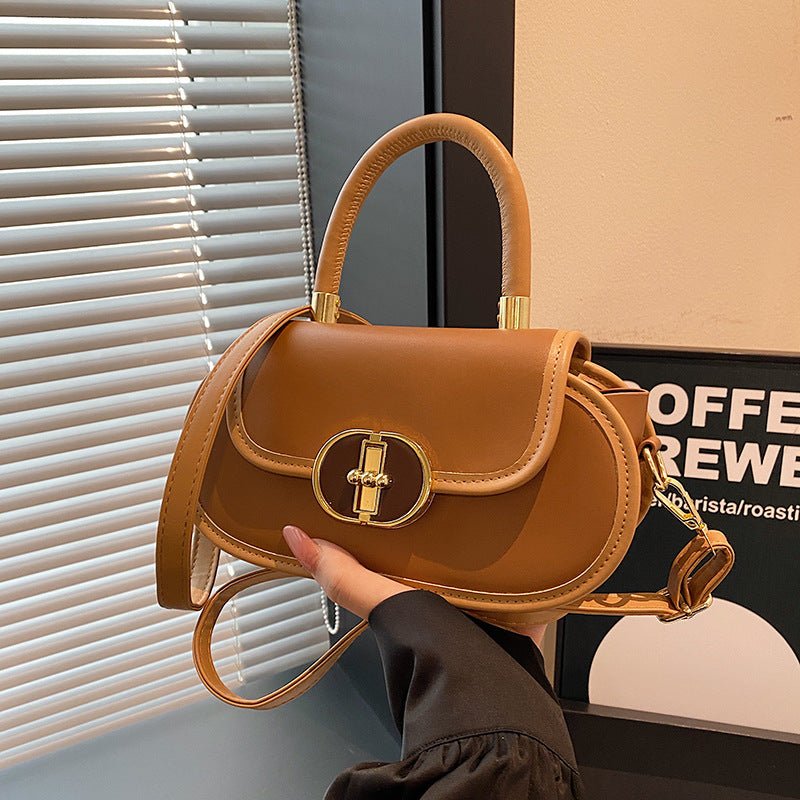 Premium retro matte tote bag in tan leather with top handle and gold oval clasp
