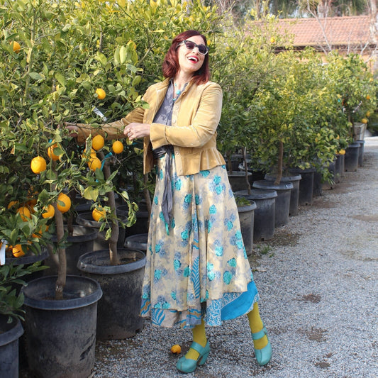 Boho plus-size sari wrap skirt made with eco-friendly yarn by Darn Good Yarn, featuring a crochet knit design and vibrant colors.