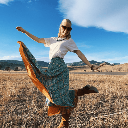 Darn Good Yarn The Original Sari Wrap Skirt in warm tones, maxi length, showcasing its colorful, flowing sari fabric design.