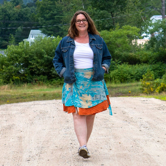 Knee-length mini sari wrap skirt by Darn Good Yarn in warm tones, showcasing colorful fabric and stylish wrap design.