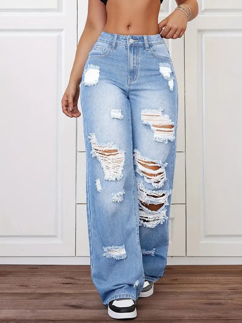 Trendy washed ripped straight jeans for women in light blue denim with distressed patches.