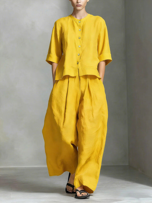 FitiqueFit three-quarter sleeve shirt and loose trousers two-piece set displayed on a model in a casual indoor setting.