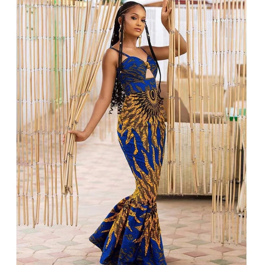 Mandotos digital print fishtail dress featuring vibrant patterns and a fitted silhouette, showcased on a model.