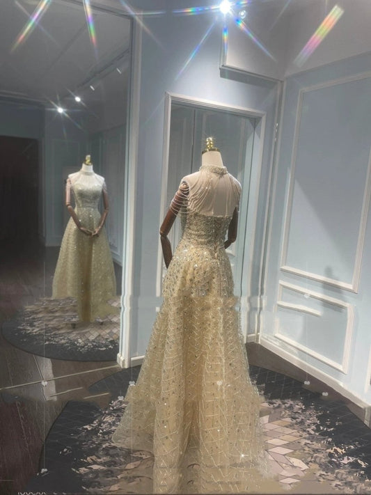 Mandotos luxury toast evening dress with a golden neck hanging light design, elegant for formal occasions.