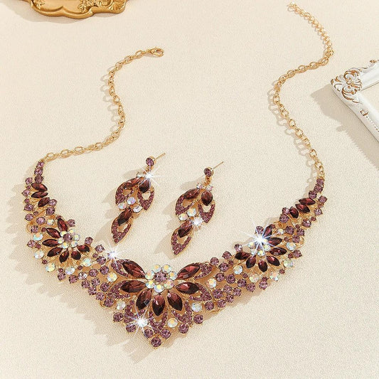 Mandotos crystal necklace and earrings suite featuring high-profile, generous design with sparkling clear crystals.