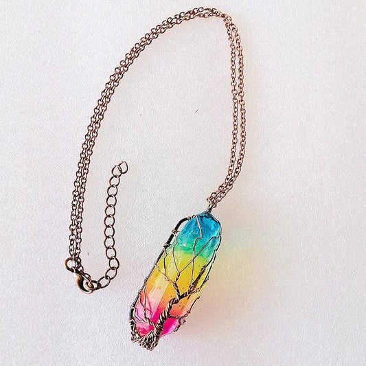 Mandotos stone crystal pillar Tree of Life pendant necklace, stylish jewelry with intricate design and natural crystal details.