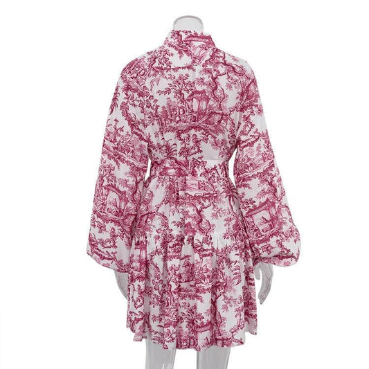 Mandotos ink print long sleeve short dress with puffy sleeves, lapel collar, tie waist, and A-line silhouette.