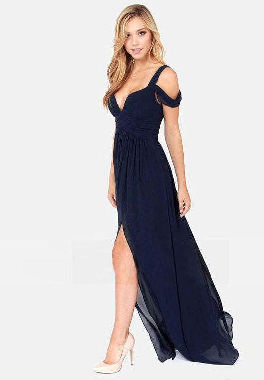 Long floor-length elegant Greek style pleated dress by MANDOTOS, featuring flowing fabric and intricate pleats for formal occasions.