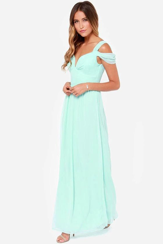 Long floor-length elegant Greek style pleated dress by MANDOTOS, shown in a flowing, sophisticated design with intricate pleats.