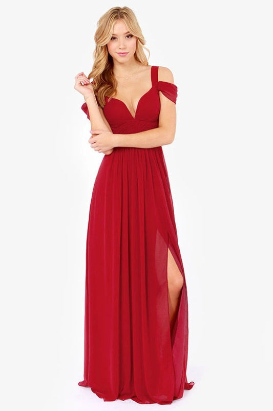 Long floor-length elegant Greek style pleated dress by MANDOTOS, showcasing flowing fabric and intricate pleats.