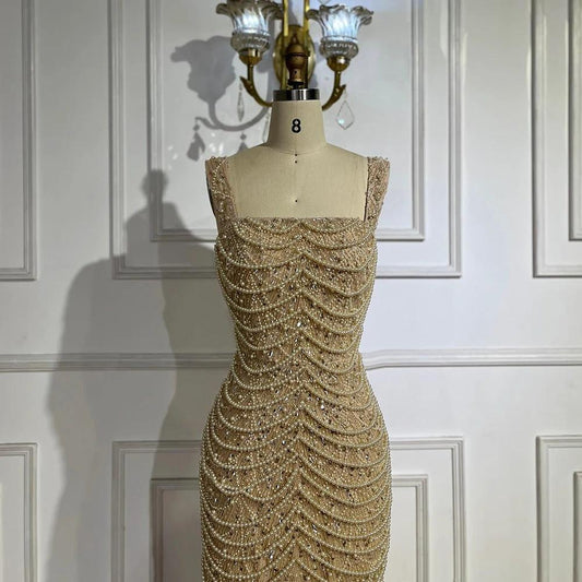 Nude elegant sling dress by MANDOTOS featuring light luxury design with pearl beaded embellishments and high-end style.