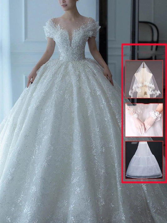 Off shoulder French main wedding dress by MANDOTOS featuring elegant design and delicate fabric for special occasions.