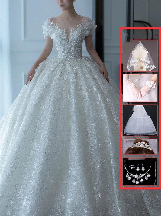 Off-shoulder French main wedding dress by MANDOTOS, featuring elegant lace details and a flowing train for bridal elegance.