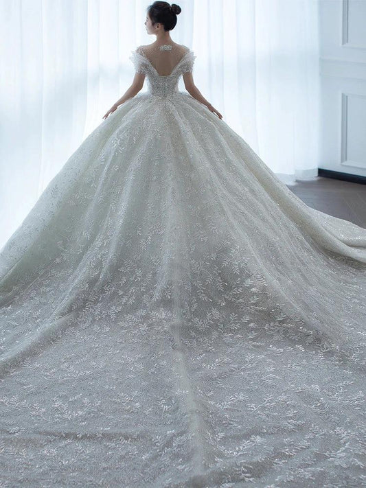 Off shoulder French main wedding dress by MANDOTOS, featuring elegant fabric and classic design perfect for bridal attire.