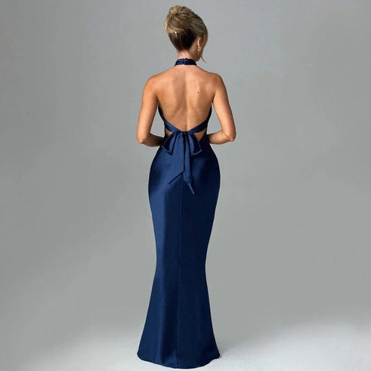 Elegant backless sleeveless summer dress by MANDOTOS, showcasing a flowing fabric and stylish design perfect for warm weather.