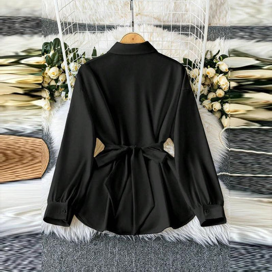 Women's elegant lapel button-down blouse by MANDOTOS with adjustable metal waist belt, solid color, loose fit for casual or office wear.