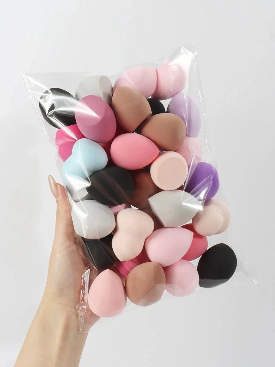 Set of 6 to 60 MANDOTOS beauty sponges and foundation mixing puffs, soft and versatile for flawless makeup application.