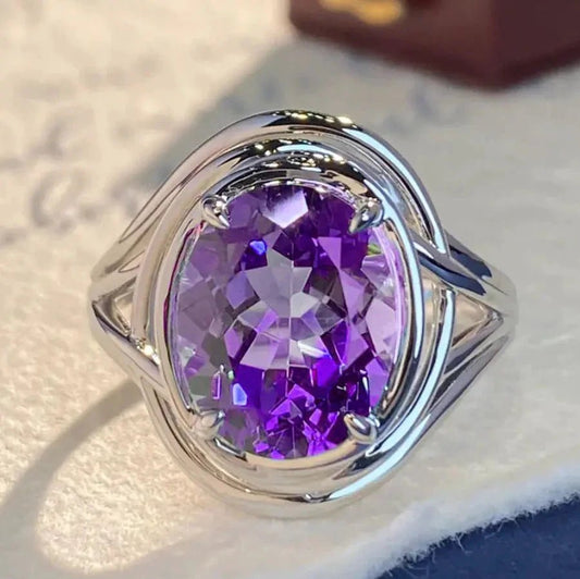 Elegant amethyst copper ring by MANDOTOS featuring a polished purple gemstone and intricate copper band design.