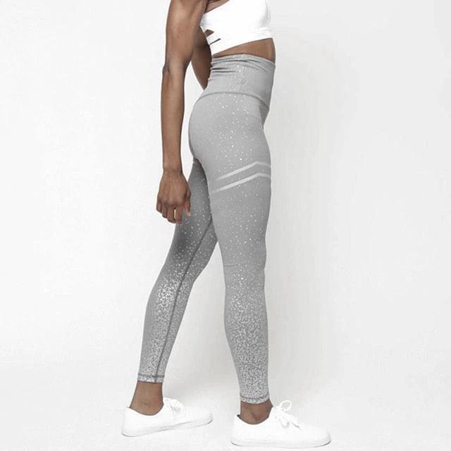 Mandotos chic gold print leggings with stylish pattern, close-up view of the vibrant gold design on black fabric.