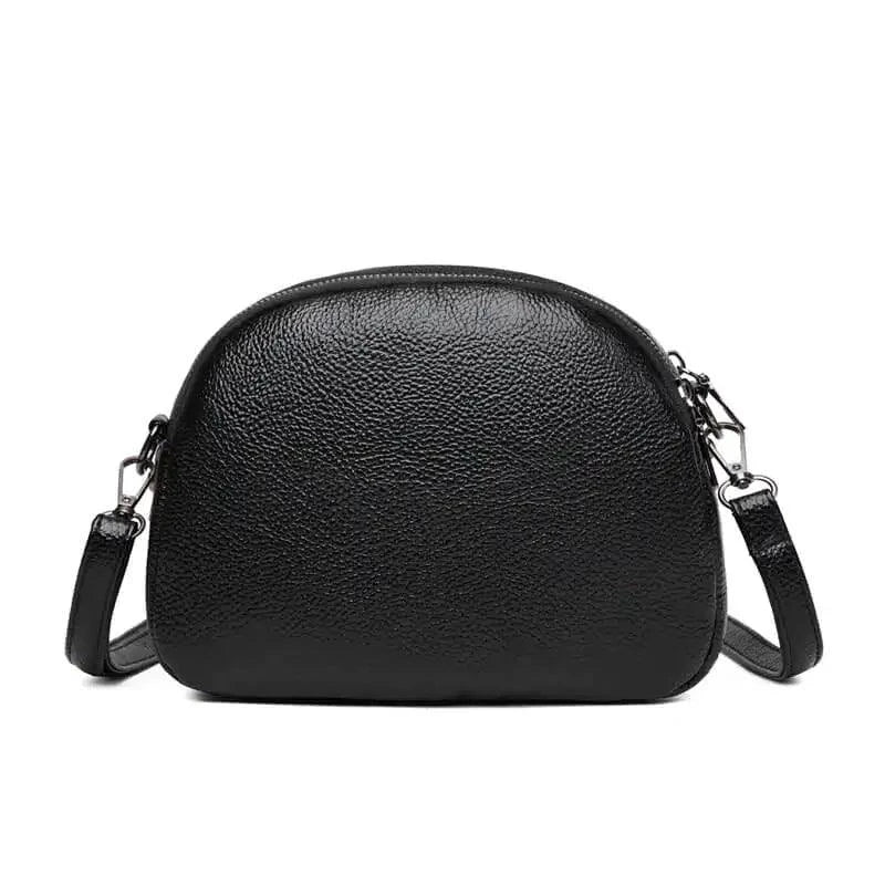 Mandotos chic leather circle purse with a sleek design and zipper closure, perfect for stylish everyday use.