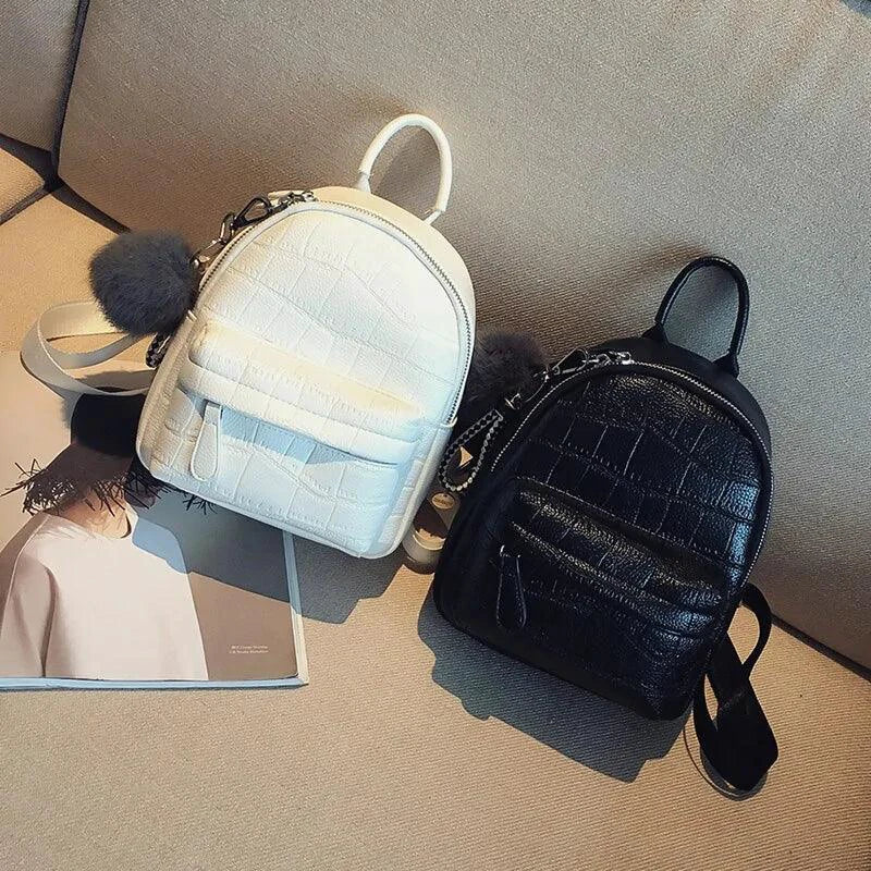 Mandotos chic mini leather backpack with adjustable straps and silver hardware, ideal for stylish everyday use.