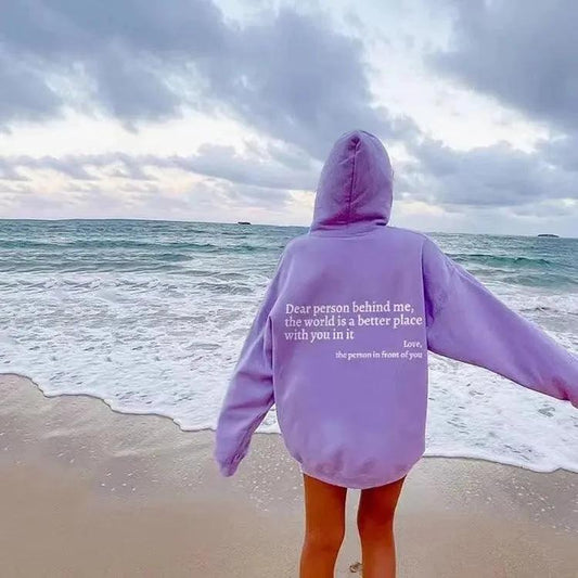 Unisex plush hoodie with printed message, kangaroo pocket, drawstrings, featuring trendy letter design by MANDOTOS.