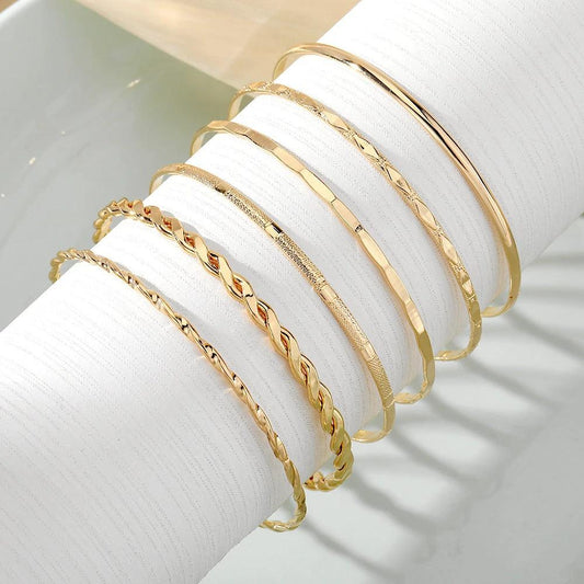 Mandotos bohemian metal chain bracelet set for women featuring six gold-colored geometric thick link bangles.
