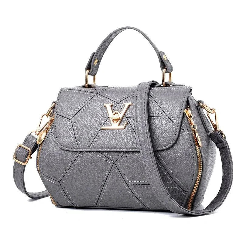 Elegant leather tote bag by MANDOTOS with sturdy handles and sleek design, perfect for everyday carry and stylish use.